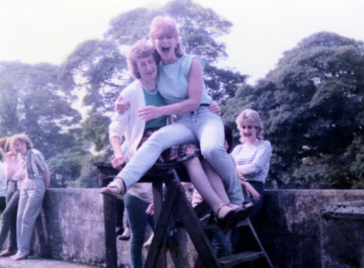 Kathleen Letters and colleagues laughing outside the Old Bleach during a lunch break in 1982