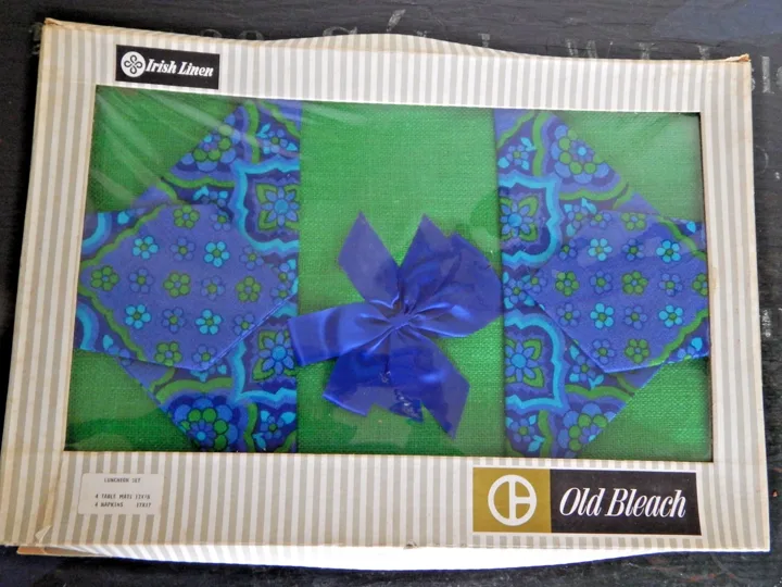 Green and blue boxed Old Bleach luncheon set with four table mats and four napkins