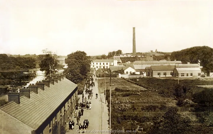 Old Bleach workers leaving the Randalstown factory with the chimney and factory buildings behind them in July 1931
